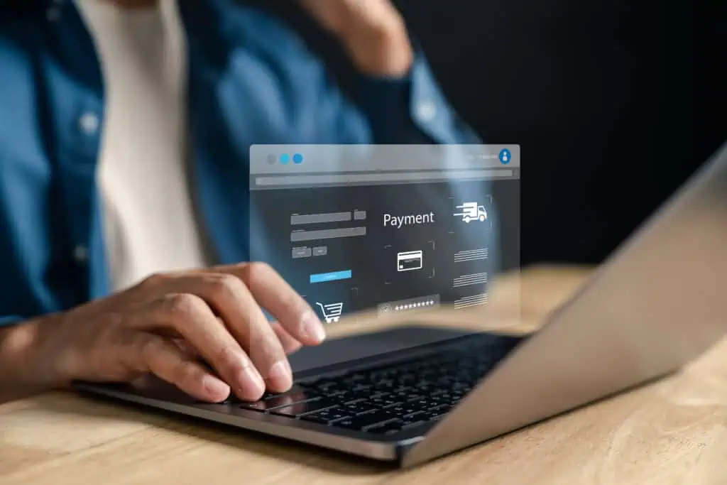 Online shopping and secure digital payment. Man making a transaction on an ecommerce platform via laptop, with virtual checkout interface, credit card input, and shipping details.
