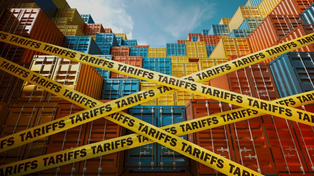 Shipping Containers Blocked by Tariffs Symbolized with Warning Tape