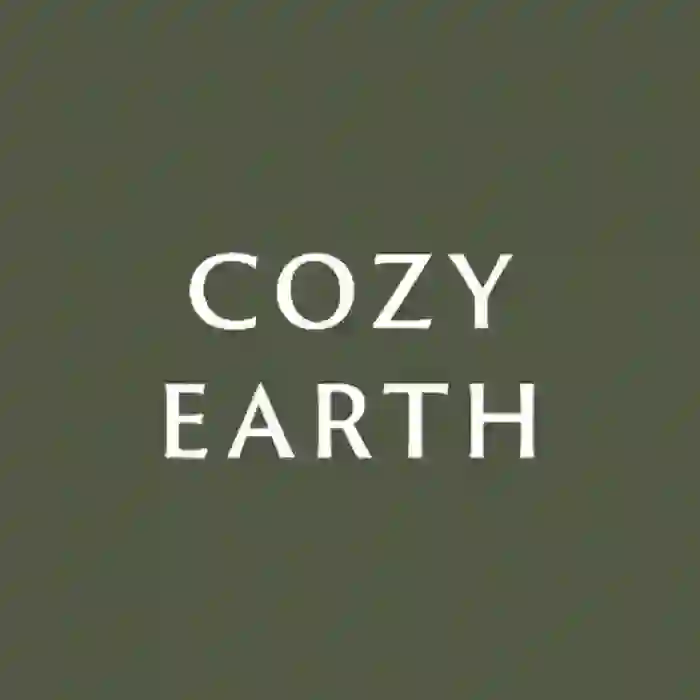Cozy Earth logo on a green background, emphasizing sustainable and luxurious bedding.